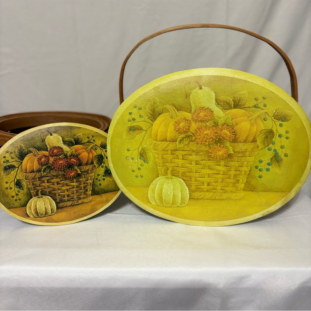 Vintage decorative woven baskets with a pumpkin and fruit harvest design.